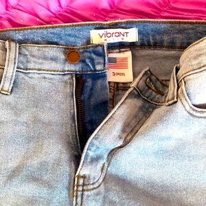 Distressed high rise denim jeans.